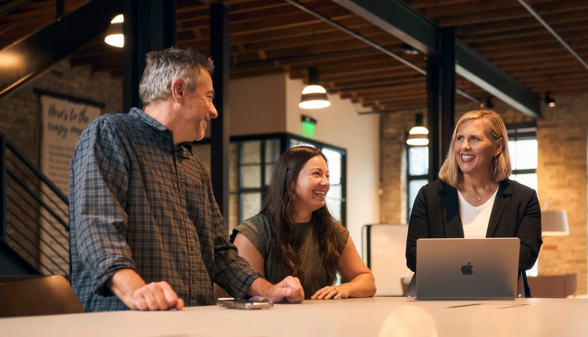 Branigan team talking around conference table